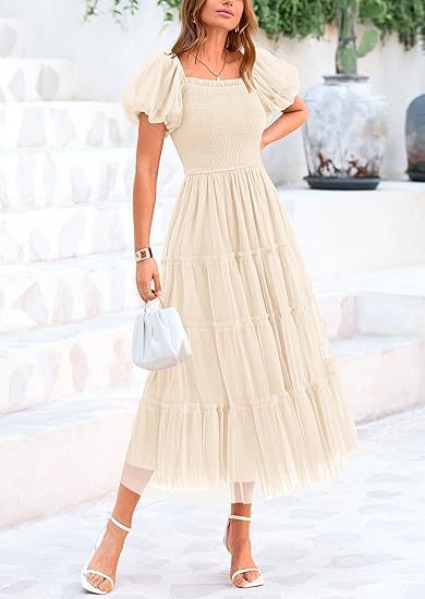 Sophisticated women's tiered maxi dress, elegant puff sleeves. Ideal for wedding guests, cocktail & special events.