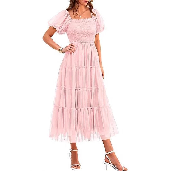 Chic women's tiered maxi dress, elegant puff sleeves. Ideal wedding guest dress for formal summer occasions.