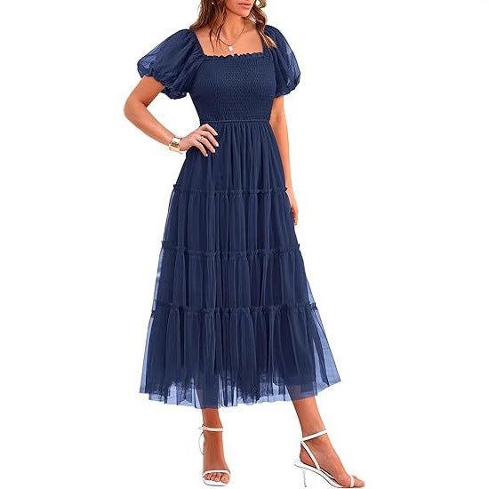 Flowy long tiered maxi dress for women. Elegant puff sleeves, perfect for summer weddings & parties.