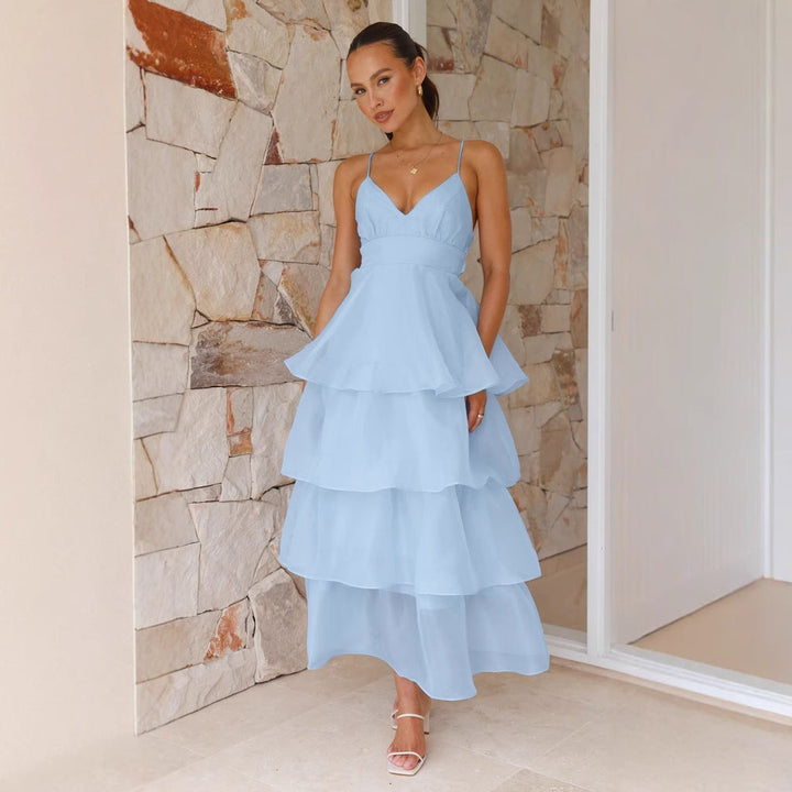 Stylish tiered maxi dress for women, ideal as a wedding guest or formal party dress. Features elegant spaghetti straps.
