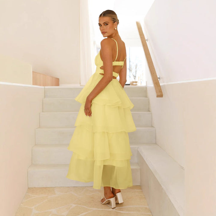 Women's elegant tiered maxi dress, a perfect formal wedding guest or occasion wear outfit with delicate spaghetti straps.