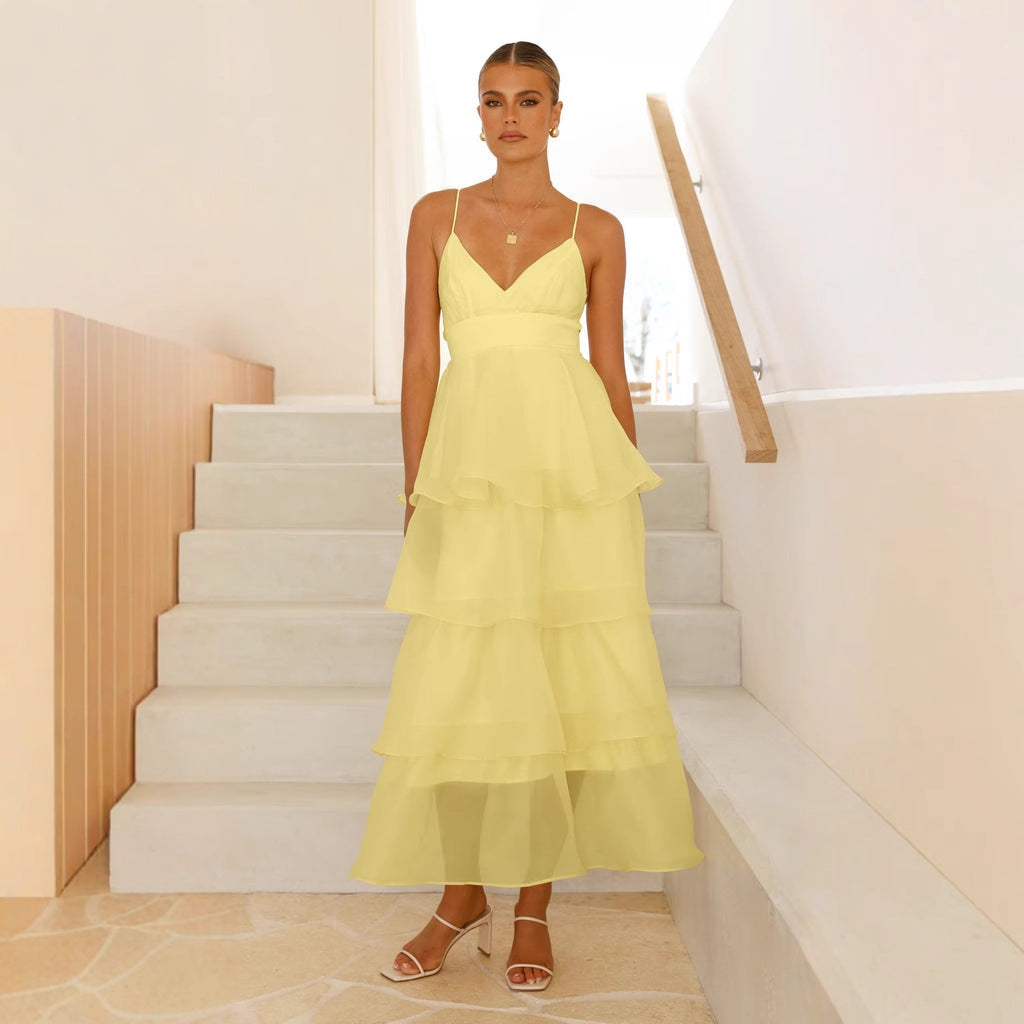 Chic women's tiered maxi formal dress with spaghetti straps, suitable for wedding guests, parties, and elegant occasions.