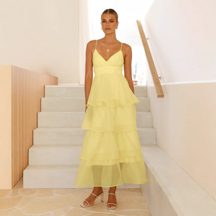 Chic women's tiered maxi formal dress with spaghetti straps, suitable for wedding guests, parties, and elegant occasions.