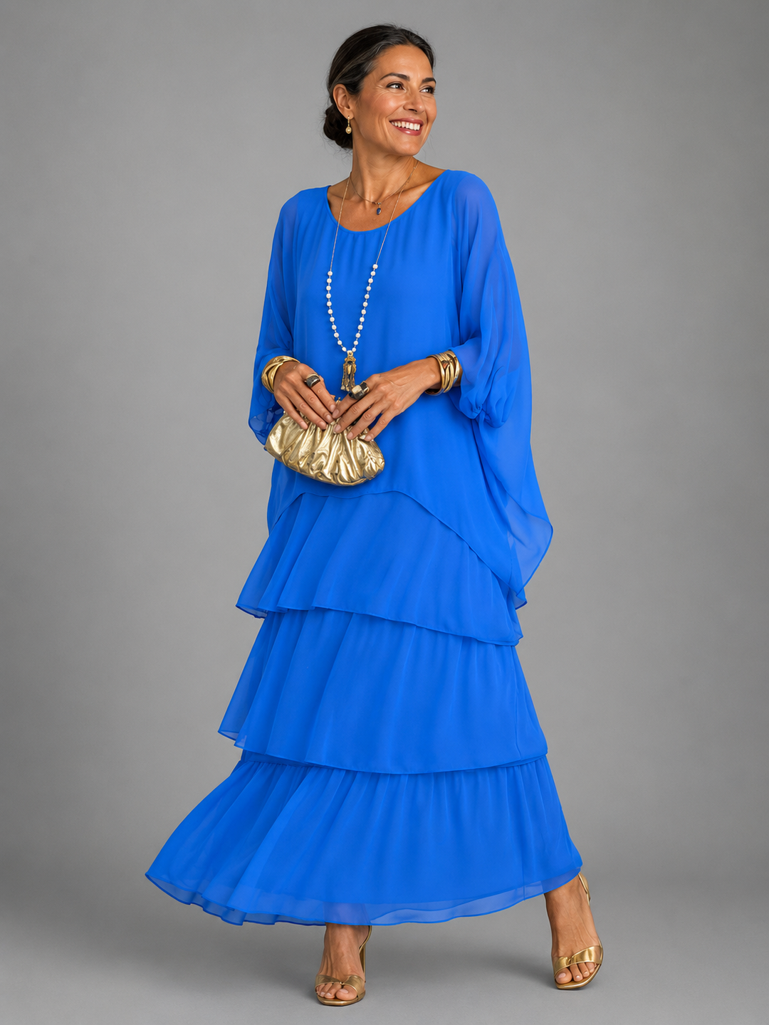 Stylish women's batwing sleeve maxi dress, elegant tiered ruffles, perfect for a flowy summer look.