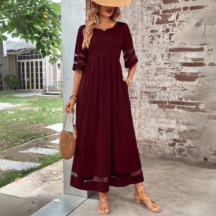 Chic women's long maxi dress with empire waist and tummy control, ideal for elegant casual wear.