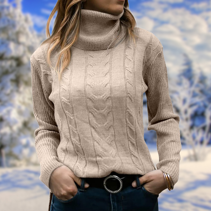 Warm women's long sleeve knit top. This elegant turtleneck jumper offers a snug, stylish fit.