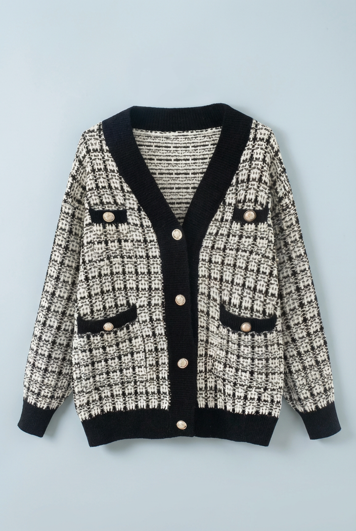 High-quality women's tweed cardigan, featuring a classic v-neck and ornate gold button embellishments.