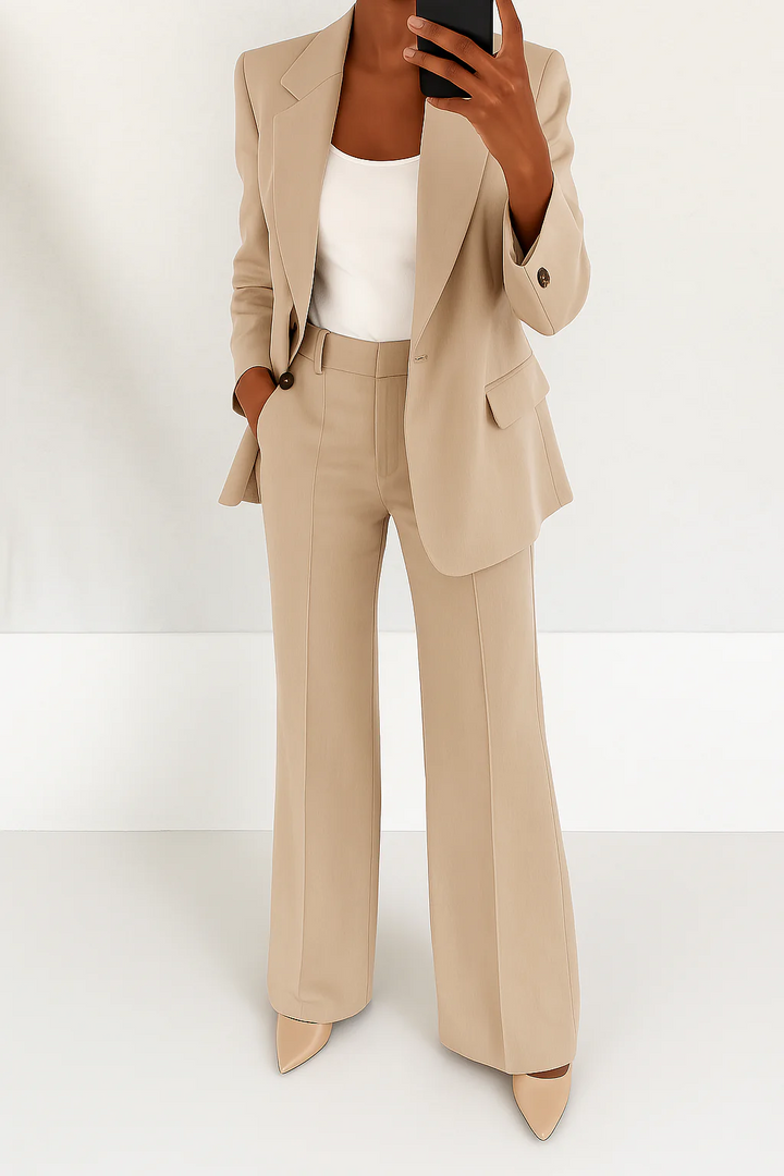Stylish women's two-piece suit set with a sleek blazer and straight-leg trousers for a polished look.