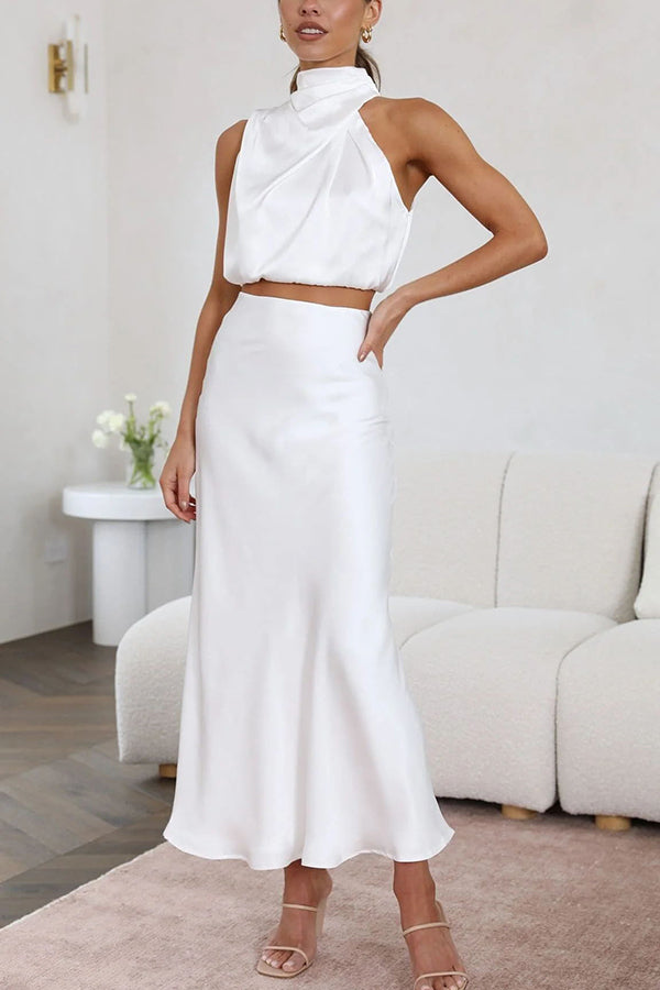 Beautiful women's two-piece maxi skirt and halter top set, perfect for special occasions.