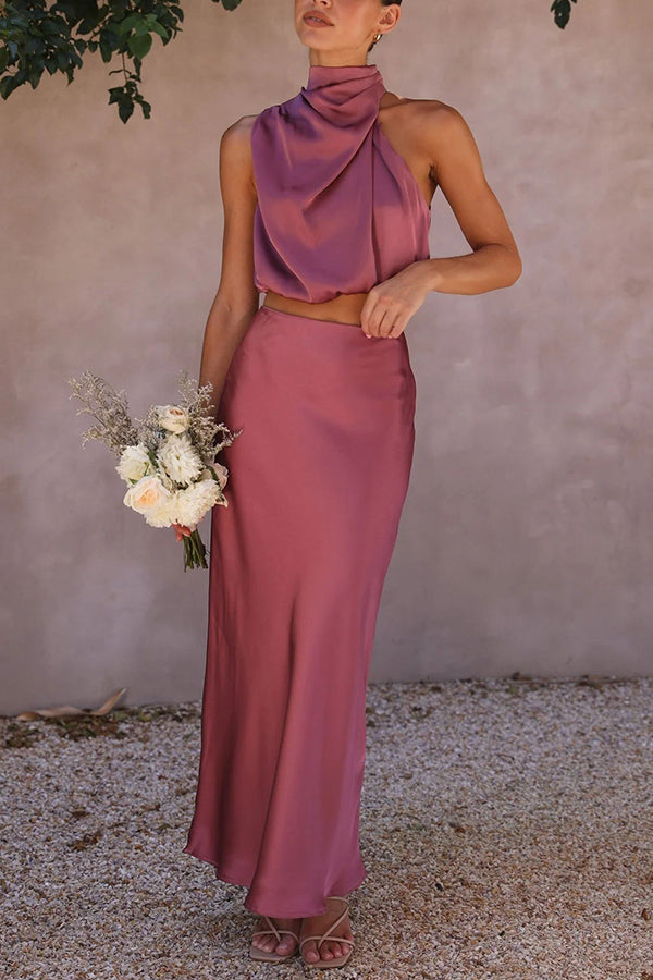 Women's stylish evening two-piece, a flattering halter top & elegant maxi skirt ensemble.