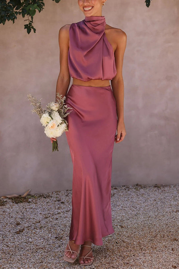Elegant women's evening set, a sophisticated halter crop top & a long, flowing maxi skirt.