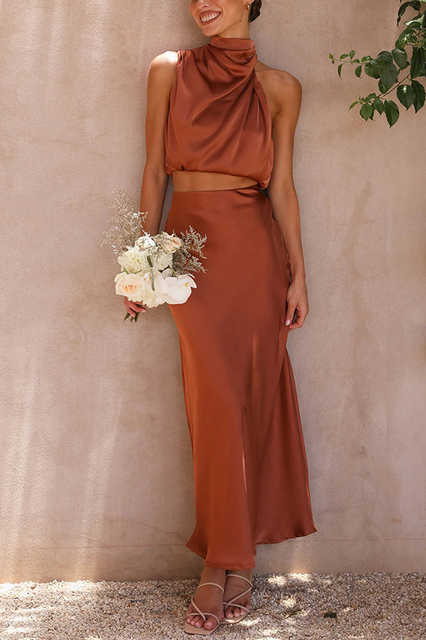 Women's glamorous two-piece outfit: halter top & maxi skirt, perfect for any special event.