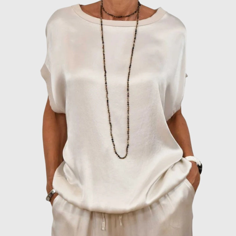 Matching women's apparel: an elegant two-piece loungewear set with comfy wide-leg pants for versatile style.