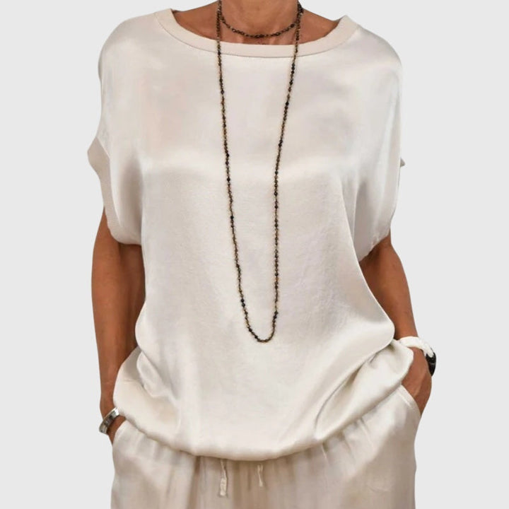 Matching women's apparel: an elegant two-piece loungewear set with comfy wide-leg pants for versatile style.