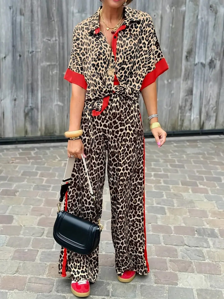 Elegant women's two-piece set: collared top & wide-leg trousers. Perfect for versatile day to night fashion.