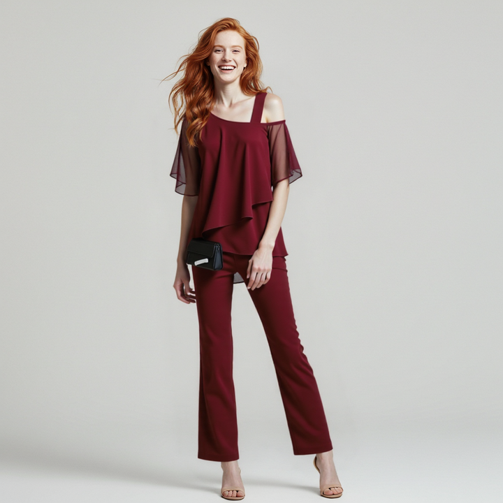 Modern women's draped two-piece set with wide-leg pants, offering versatile fashion for day or evening.