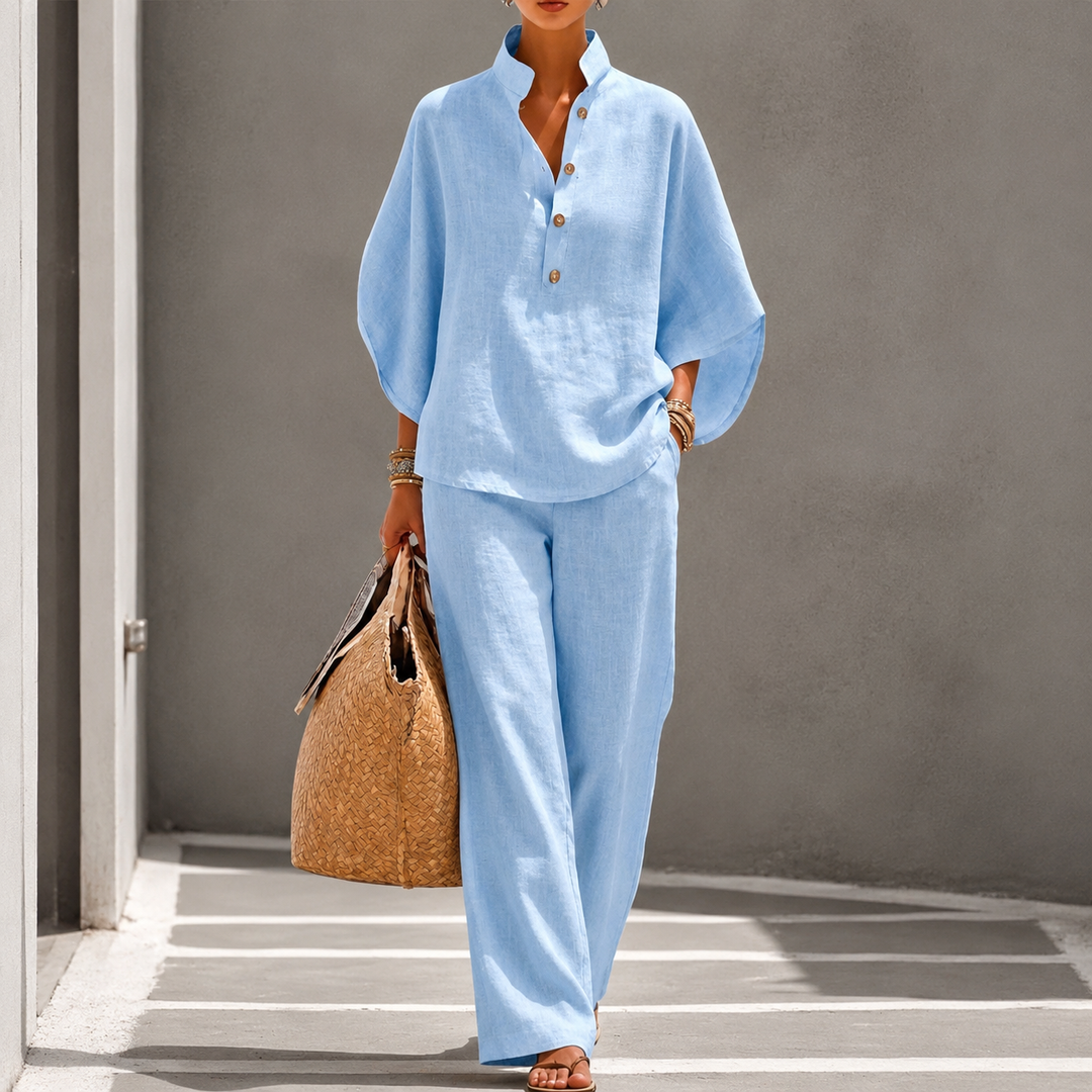 Elegant women's two-piece set: relaxed fit blouse & wide-leg trousers. Perfect for versatile fashion.