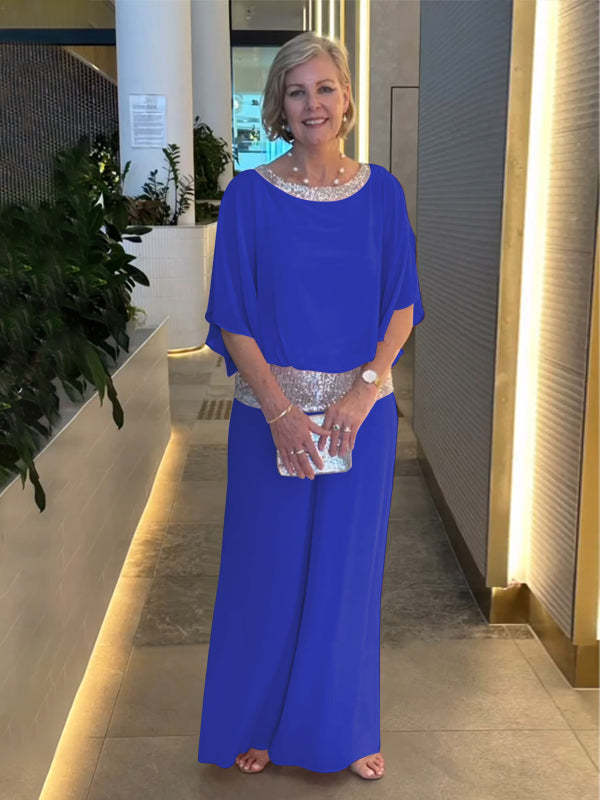 Sophisticated women's fashion set: elegant wide-sleeve top and matching wide-leg pants for a chic and formal look.