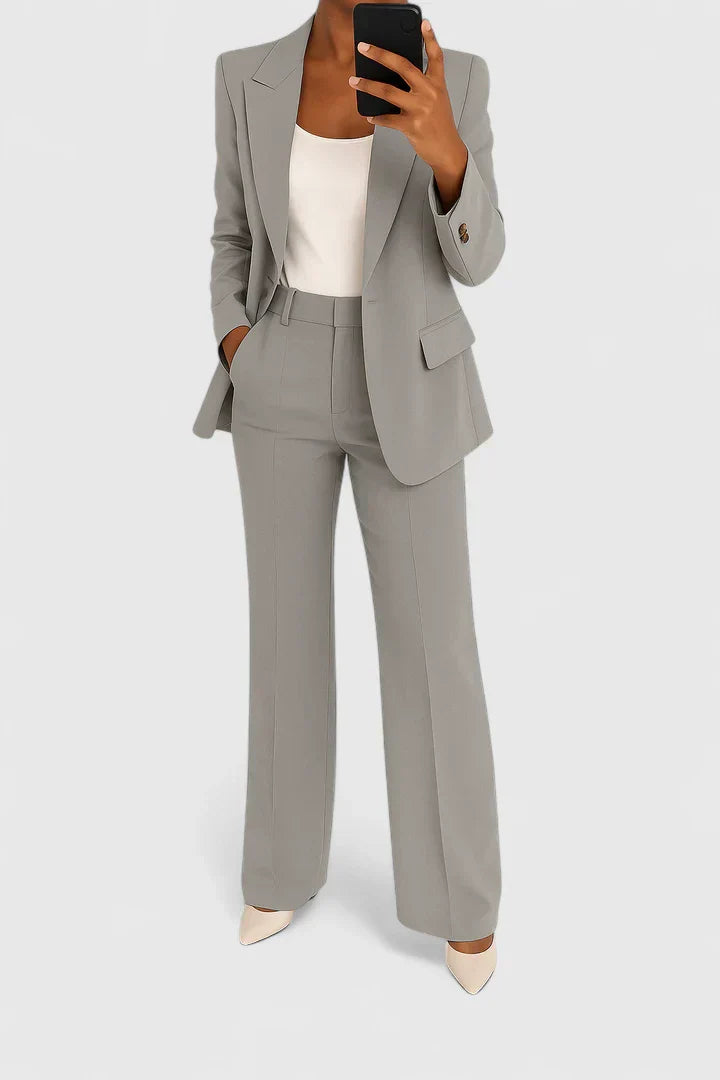 Professional women's two-piece suit set. Chic, elegant ensemble for business wear, office, or formal occasions.