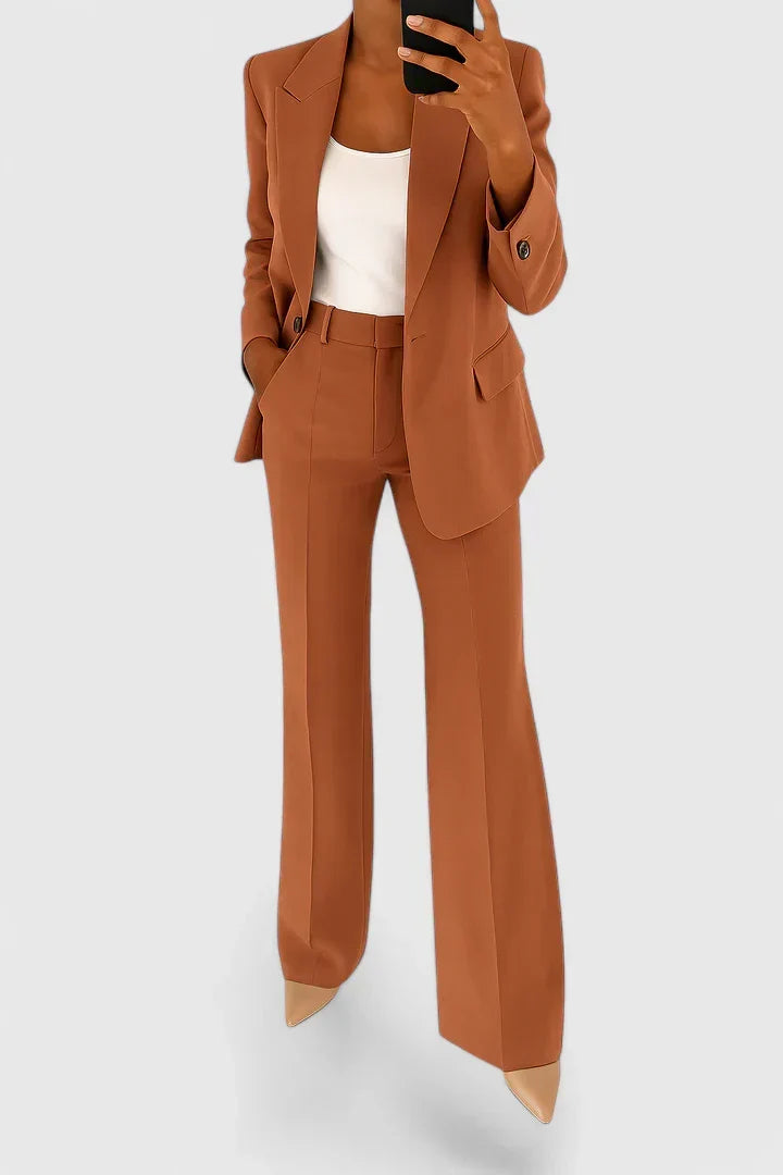 Classic women's two-piece suit set. Elegant professional attire, perfect for office wear or a sophisticated formal look.
