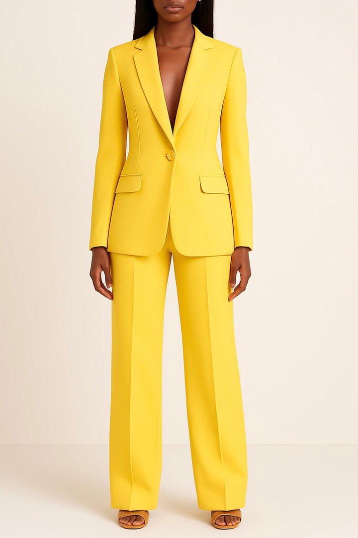 Close-up of a tailored women's two-piece suit fabric, showcasing the elegant cut of the blazer & trousers for professional wear.