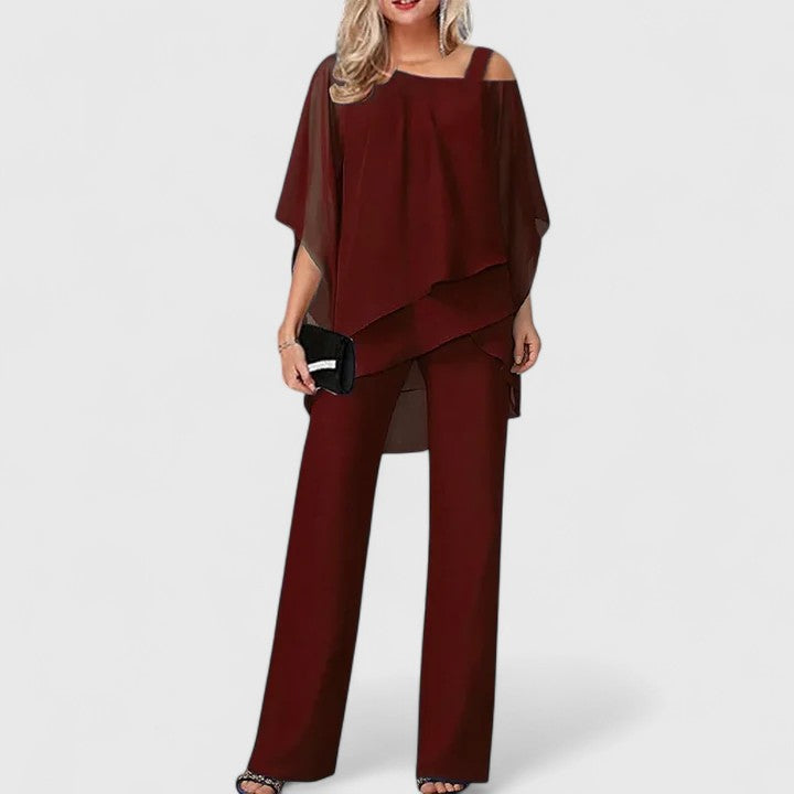 Elegant women's two-piece trouser set for smart casual wear. Versatile matching pants and top outfit.