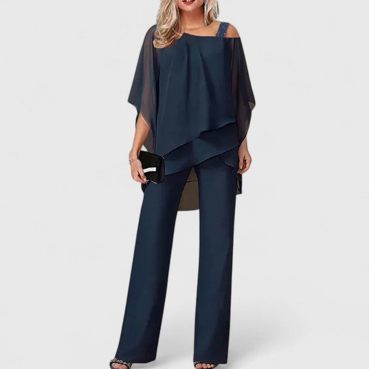 Modern women's matching two-piece set featuring elegant trousers and top for comfortable style.