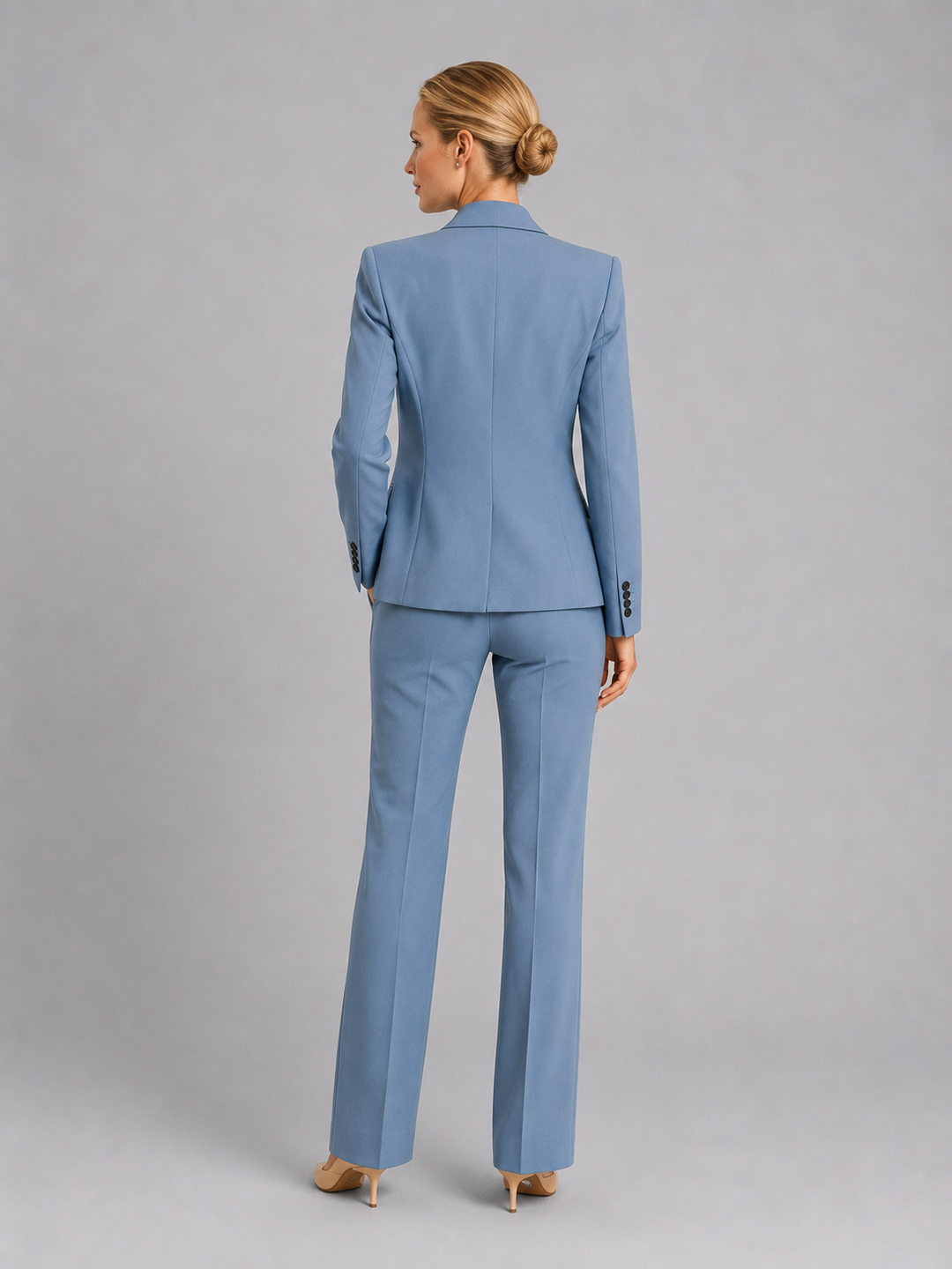 Sophisticated women's tailored trouser suit with a flattering fit, ideal for elegant occasionwear.