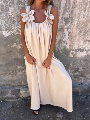 Close-up of elegant bow strap detail on women's U-neck maxi dress, adding a stylish touch.