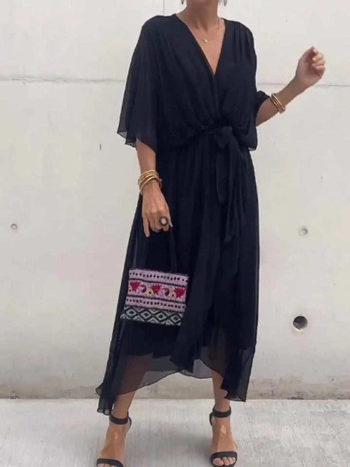 Chiffon V-neck midi dress for women, featuring a flattering belted waist, perfect for elegant party wear.
