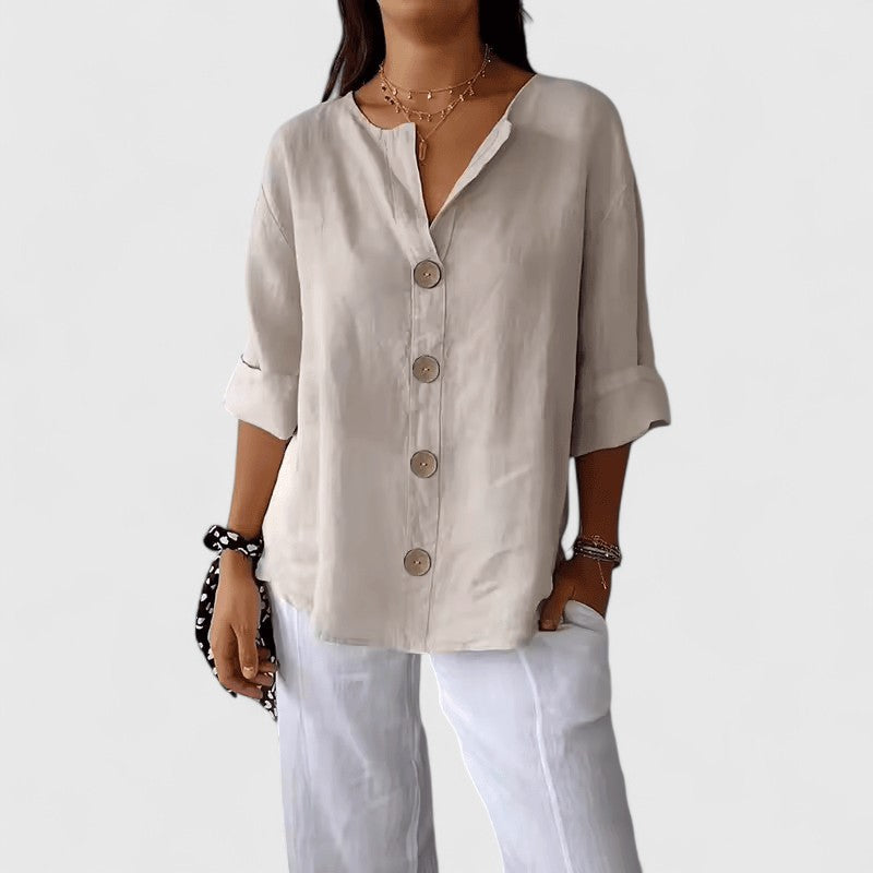 Elegant women's V-neck blouse, button-front, perfect for work or casual spring/summer wear.