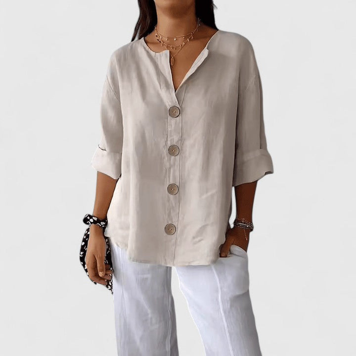 Elegant women's V-neck blouse, button-front, perfect for work or casual spring/summer wear.