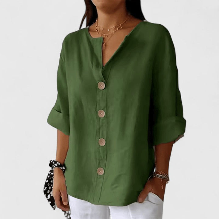 Versatile women's button-front V-neck blouse, relaxed fit, ideal for casual or professional spring attire.