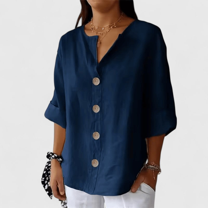 Stylish ladies V-neck button-front blouse, great for spring/summer, offers elegant casual comfort.