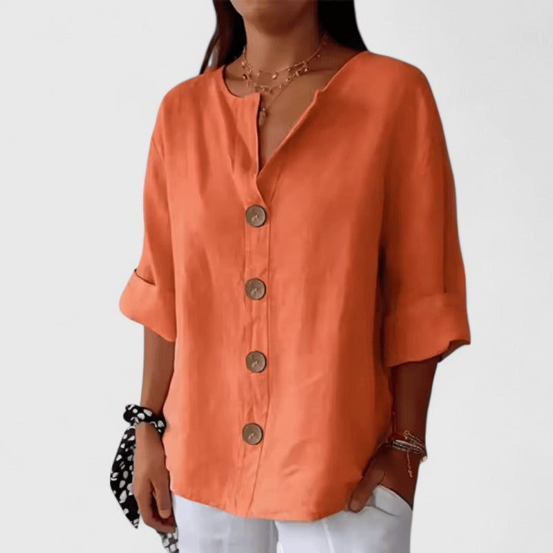 Women's elegant button-front V-neck blouse, versatile ladies fashion for spring, relaxed fit.