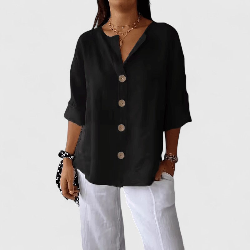Classic women's V-neck button-front blouse, elegant and comfortable for work or everyday casual wear.