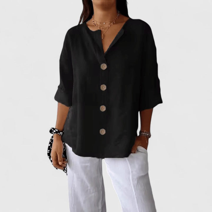 Classic women's V-neck button-front blouse, elegant and comfortable for work or everyday casual wear.