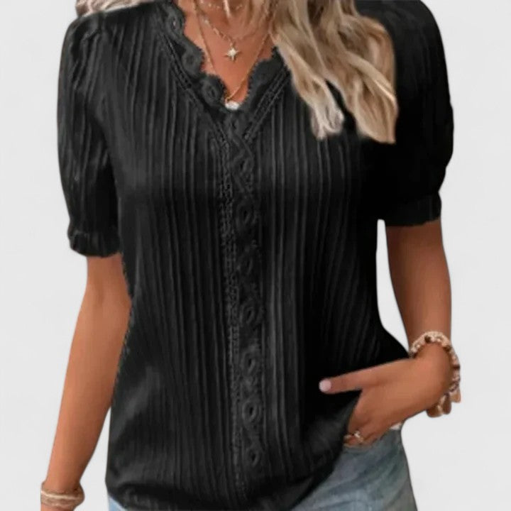 Elegant women's V-neck blouse with intricate hollow short sleeves, perfect for summer style.