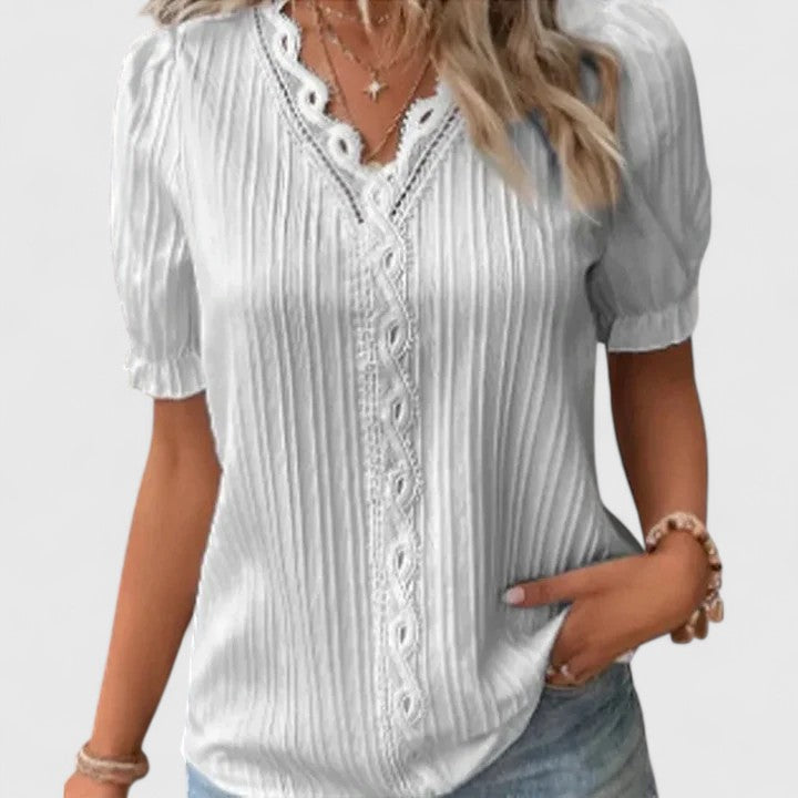 Chic women's V-neck top with sophisticated hollow sleeves, a key piece for stylish spring & summer fashion.