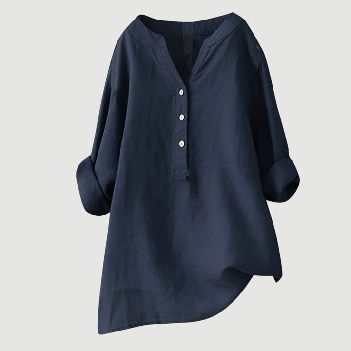 Refined V-neck button-down women's shirt. Elegant long sleeve top, perfect for casual outfits or spring wear.