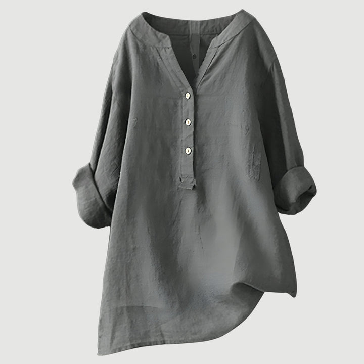 Fashionable women's V-neck button-down shirt. Long sleeve casual top, elegant and versatile for everyday chic.