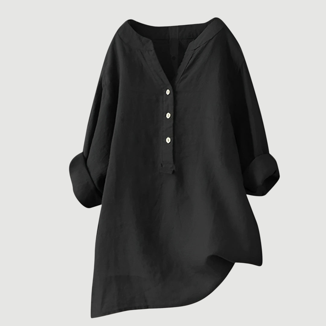 Classic women's V-neck button-down shirt. Elegant long sleeve top with a relaxed fit for casual spring style.