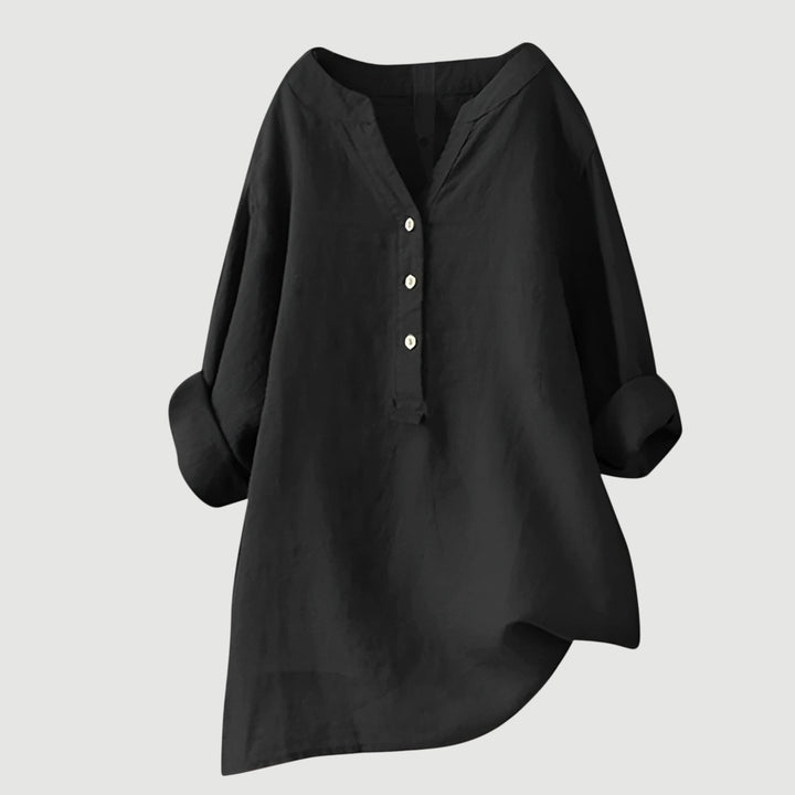 Classic women's V-neck button-down shirt. Elegant long sleeve top with a relaxed fit for casual spring style.