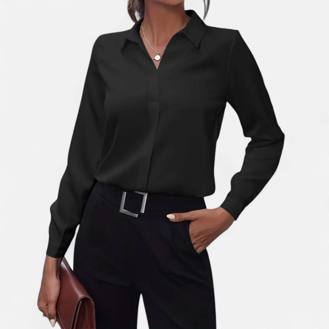 Elegant women's V-neck button-up blouse in classic white, perfect workwear.