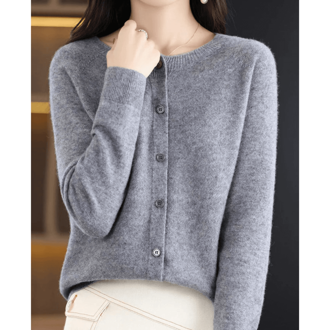 Women's elegant V-neck cardigan. Solid color, long sleeve, button-up sweater for versatile layering.