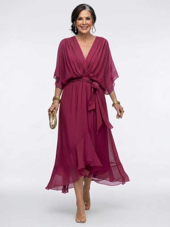 Detailed shot of the draped waist tie on a comfortable V-neck short sleeve midi dress, a key design element.