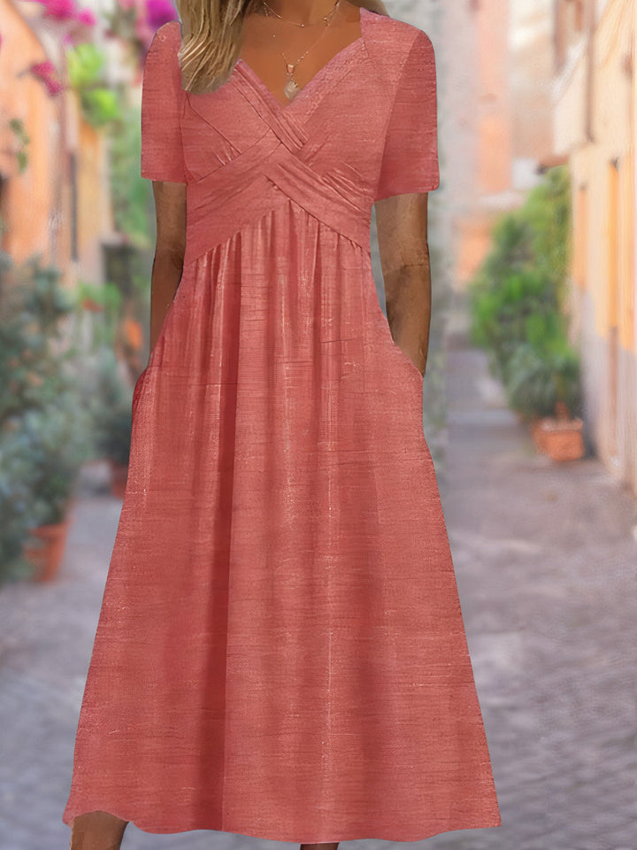 Women's flowy V-neck dress with tummy-covering design. Versatile for casual outings, summer events, or elegant spring wear.