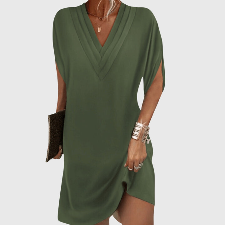 Flowy, comfortable V-neck dress for women. Versatile for spring & summer casual or party wear. Elegant design.