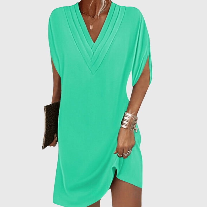 Comfortable women's V-neck casual dress. Flowy fabric and tummy control make it versatile for daily wear or spring/summer.