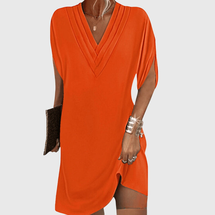 Flattering women's elegant V-neck dress, featuring tummy control for a smooth silhouette. Ideal for any stylish occasion.